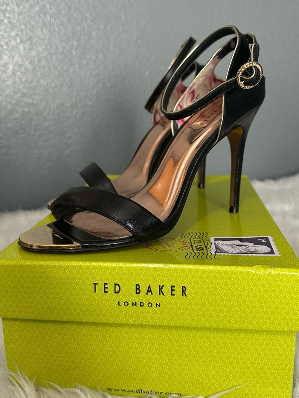Ted Baker Mirobell Black Leather Open-Toe Stiletto Sandals with Gold Accent